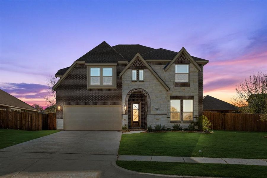 Front exterior of a new home in Sable Creek, Sanger, TX, highlighting curb appeal (Image 1).