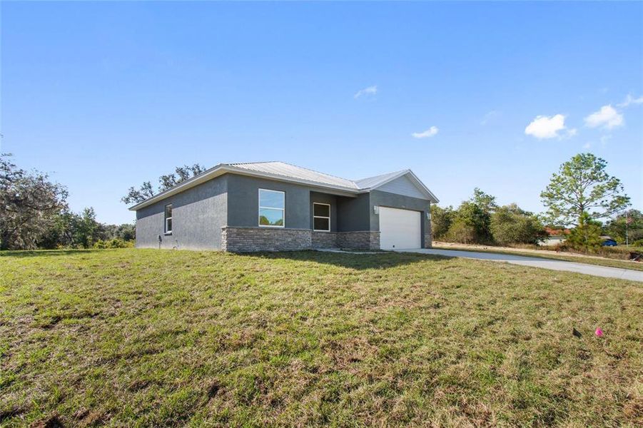 Front exterior of a new home in , Lake Wales, FL, highlighting curb appeal (Image 21).