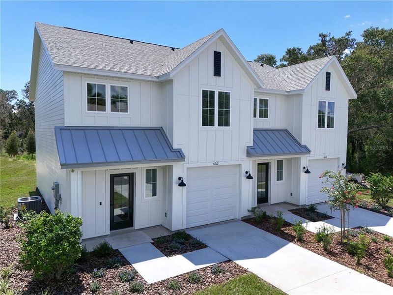 Front exterior of a new home in , Mount Dora, FL, highlighting curb appeal (Image 22).