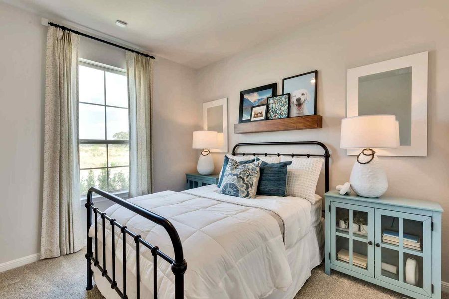 A window-filled bedroom, perfectly capturing the essence of cozy living. A window-filled bedroom, perfectly capturing the essence of cozy living.
