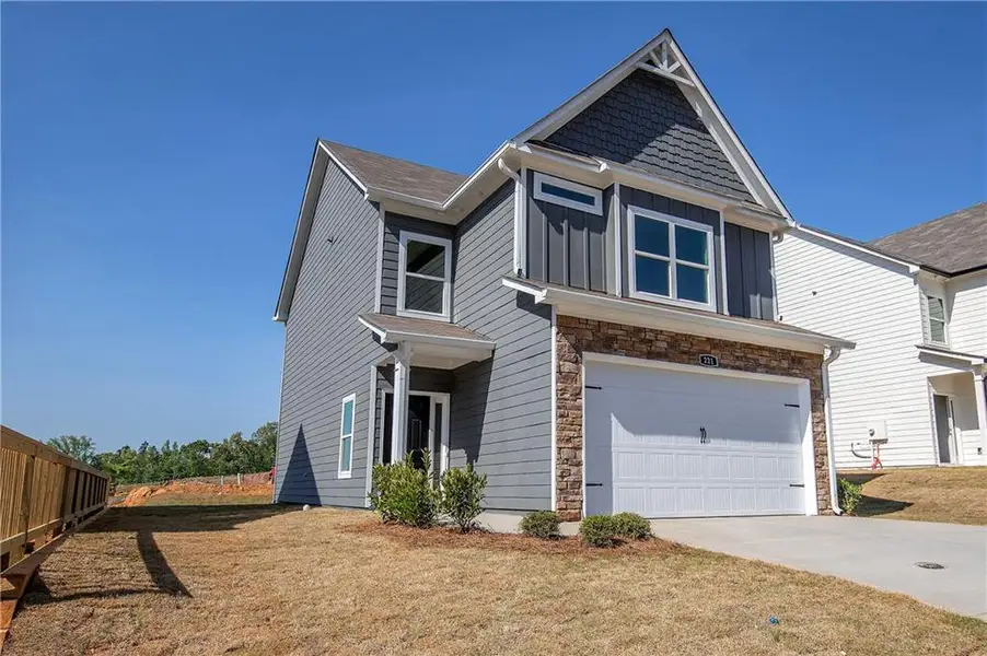 Front exterior of a new home in , Cartersville, GA, highlighting curb appeal (Image 2). Front exterior of a new home in , Cartersville, GA, highlighting curb appeal (Image 2).