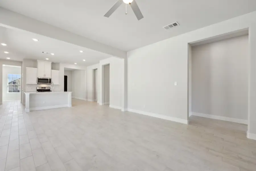 Representative unfurnished interior of a home built from the Waverly III by Megatel Homes in Bellagio, Forney (Image 11).