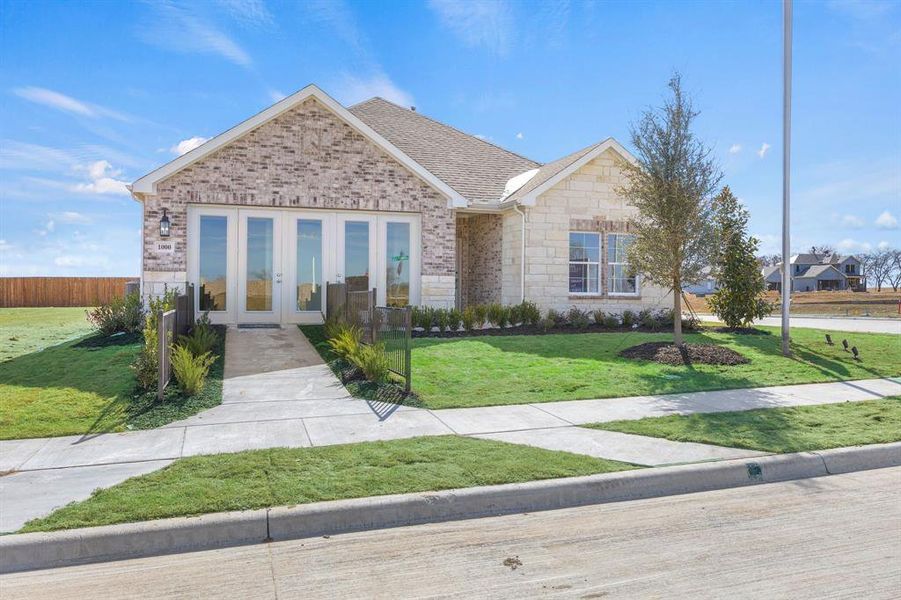 Front exterior of a new home in Anna Town Square, Anna, TX, highlighting curb appeal (Image 1). Front exterior of a new home in Anna Town Square, Anna, TX, highlighting curb appeal (Image 1).
