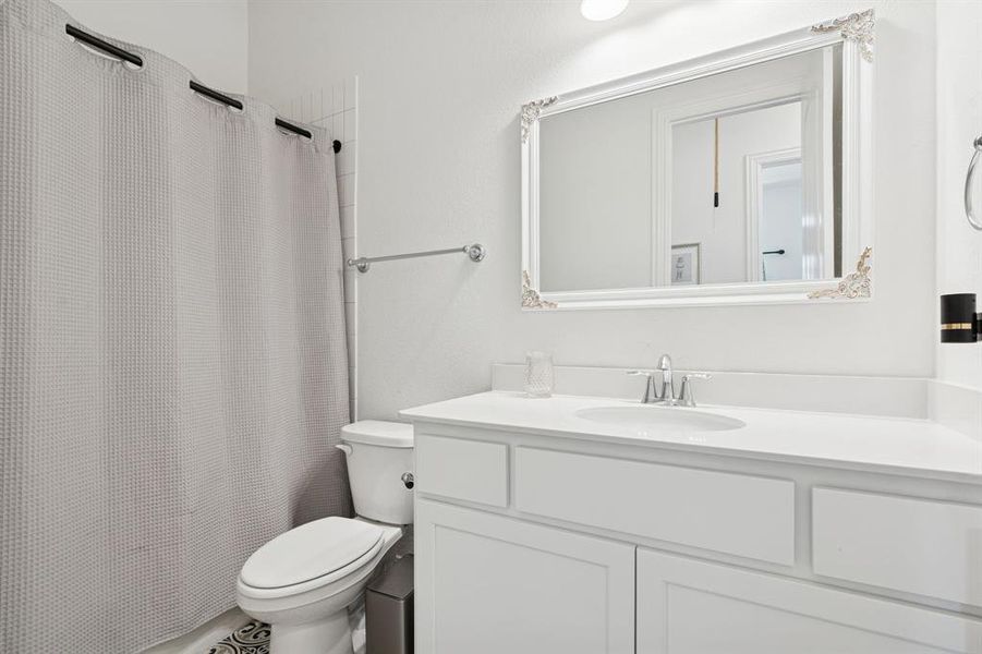 Bathroom featuring vanity and toilet Bathroom featuring vanity and toilet