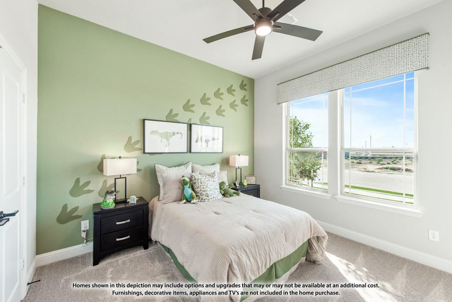 Children's bedroom with green accent wall, dinosaur decor, ceiling fan, and large window Children's bedroom with green accent wall, dinosaur decor, ceiling fan, and large window