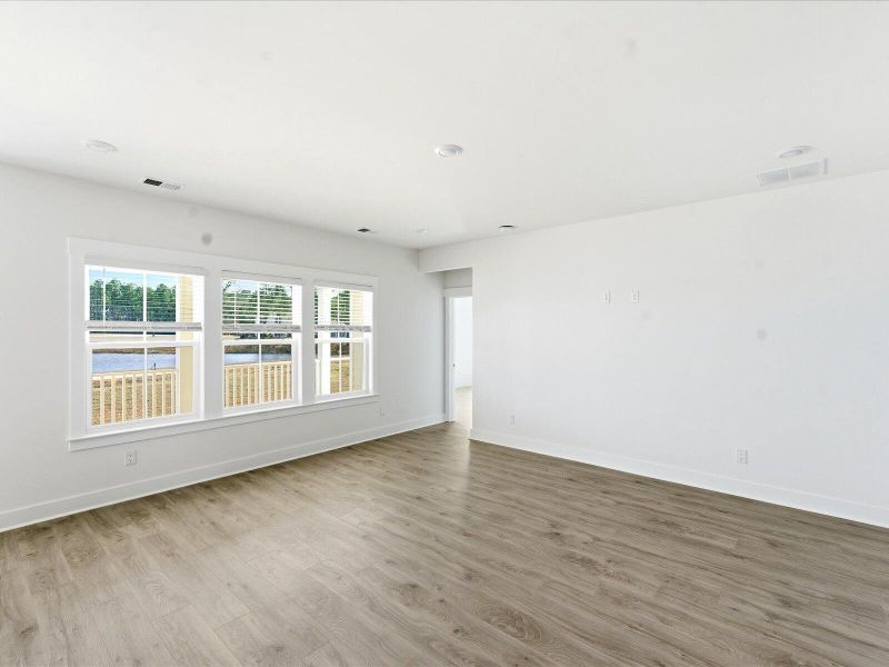 Spacious, unfurnished interior of a new home in The Coves at Lakes of Cane Bay II, Summerville (Image 23).