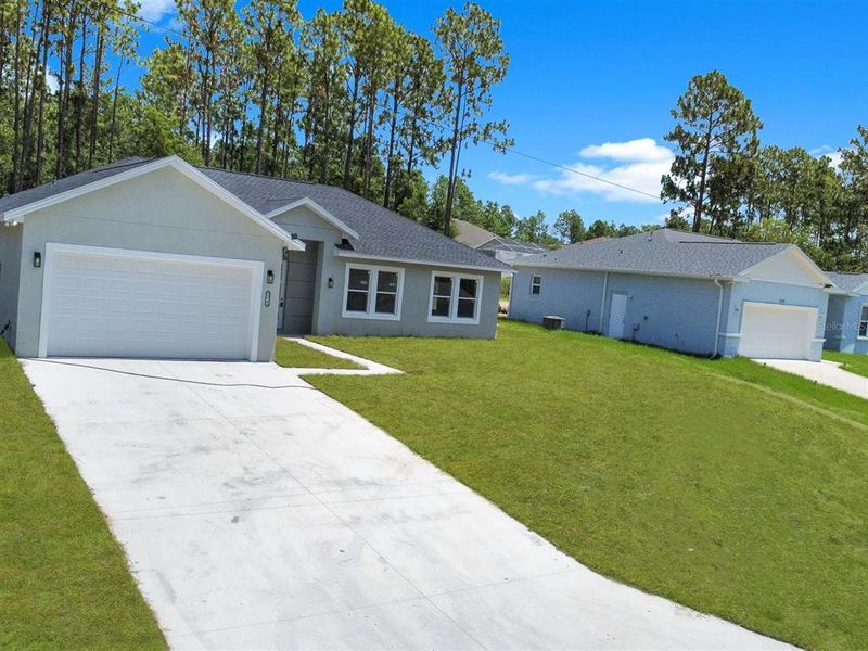 Front exterior of a new home in , Ocala, FL, highlighting curb appeal (Image 23). Front exterior of a new home in , Ocala, FL, highlighting curb appeal (Image 23).