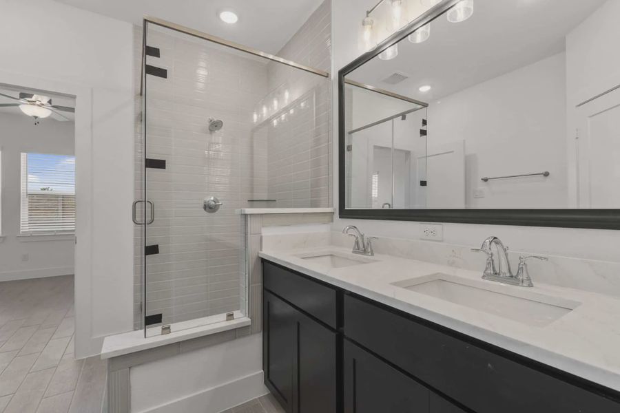 Representative furnished interior of a home built from the Carriagehouse by Chesmar Homes in Meridiana Townhomes, Iowa Colony (Image 59).