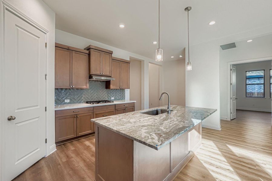 Furnished interior view inside a new home in 6 Creeks, Kyle (Image 5).