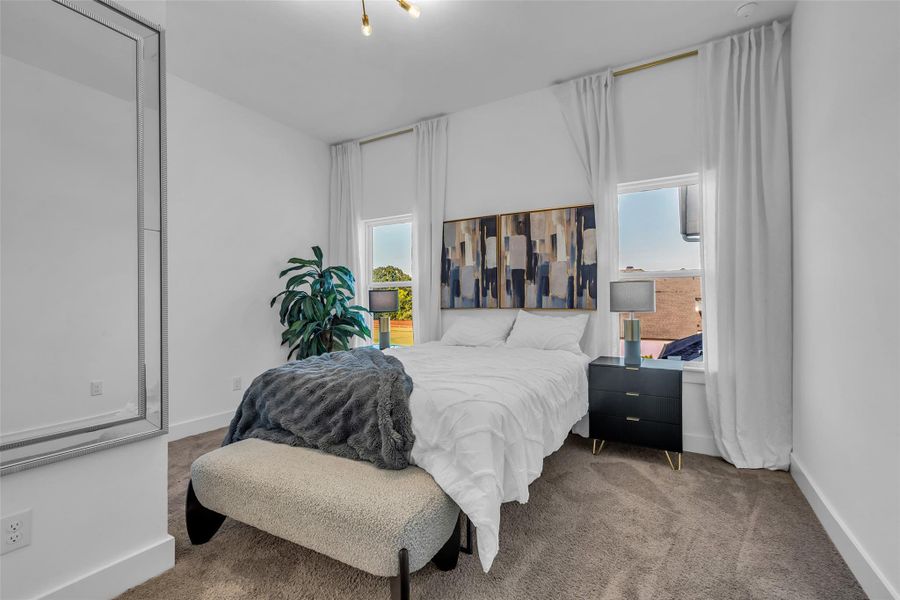 Bedroom Suite:Bathed in natural light, this suite blends modern elegance with serene comfort. Tall windows, layered textures, and curated details create a restful retreat designed for both style and relaxation.