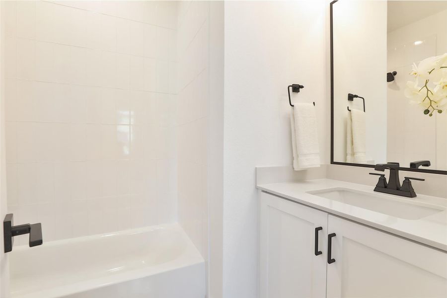 A secondary bathroom conveniently located on the lower level & located inside the guest bedroom.