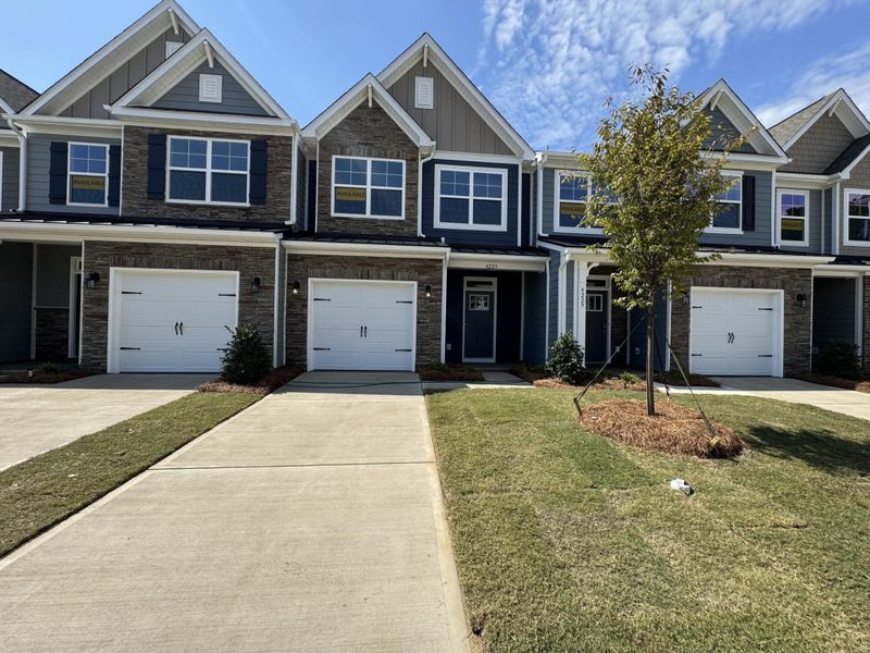 Front exterior of a new home in Harrisburg Village Townhomes, Harrisburg, NC, highlighting curb appeal (Image 1). Front exterior of a new home in Harrisburg Village Townhomes, Harrisburg, NC, highlighting curb appeal (Image 1).