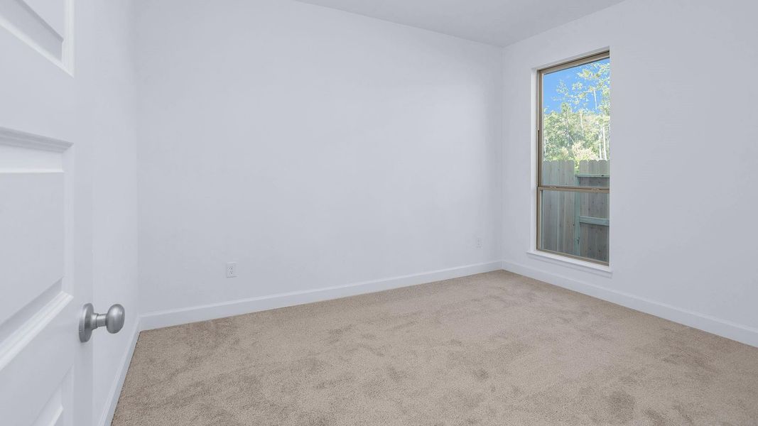 Spacious, unfurnished interior of a new home in Artavia 45', Conroe (Image 4).