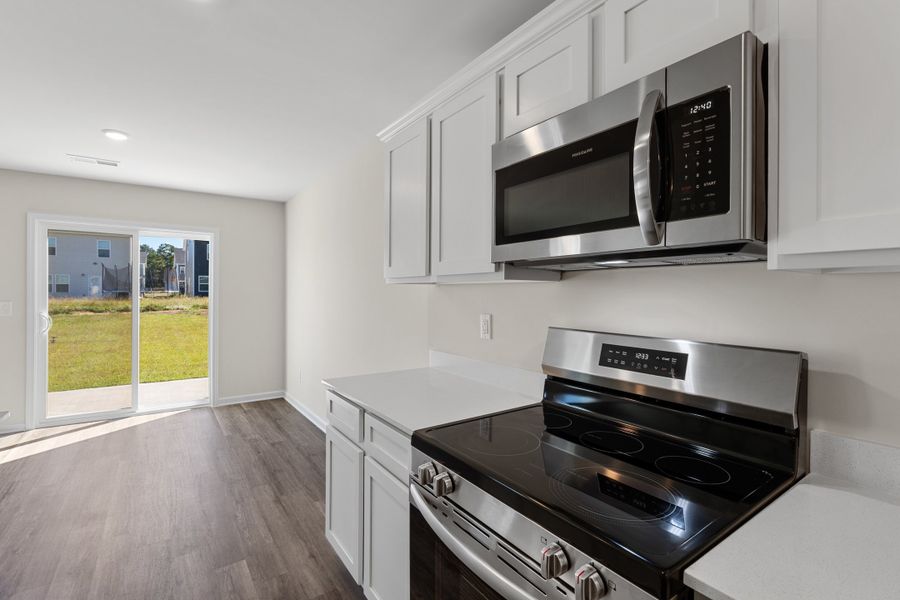 Representative furnished interior of a home built from the Larch Duplex by McGuinn Homes in South Lake Commons, Lexington (Image 5).