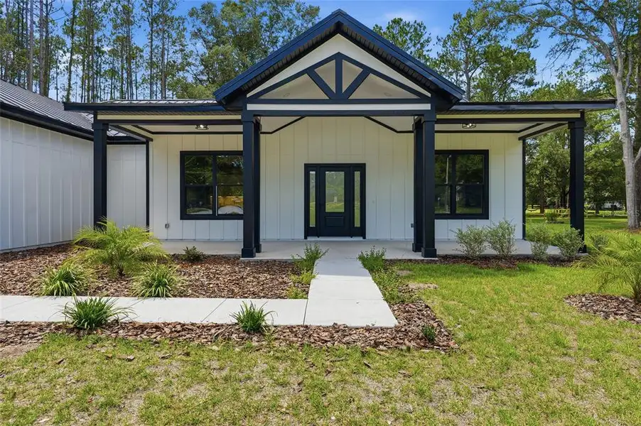 Front exterior of a new home in , High Springs, FL, highlighting curb appeal (Image 2). Front exterior of a new home in , High Springs, FL, highlighting curb appeal (Image 2).
