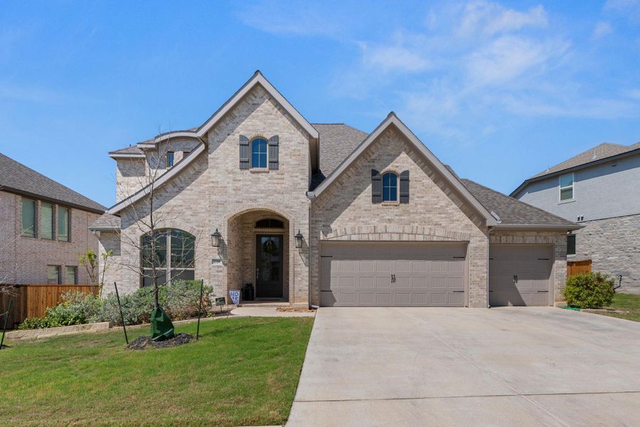 Front exterior of a new home in 6 Creeks, Kyle, TX, highlighting curb appeal (Image 1). Front exterior of a new home in 6 Creeks, Kyle, TX, highlighting curb appeal (Image 1).