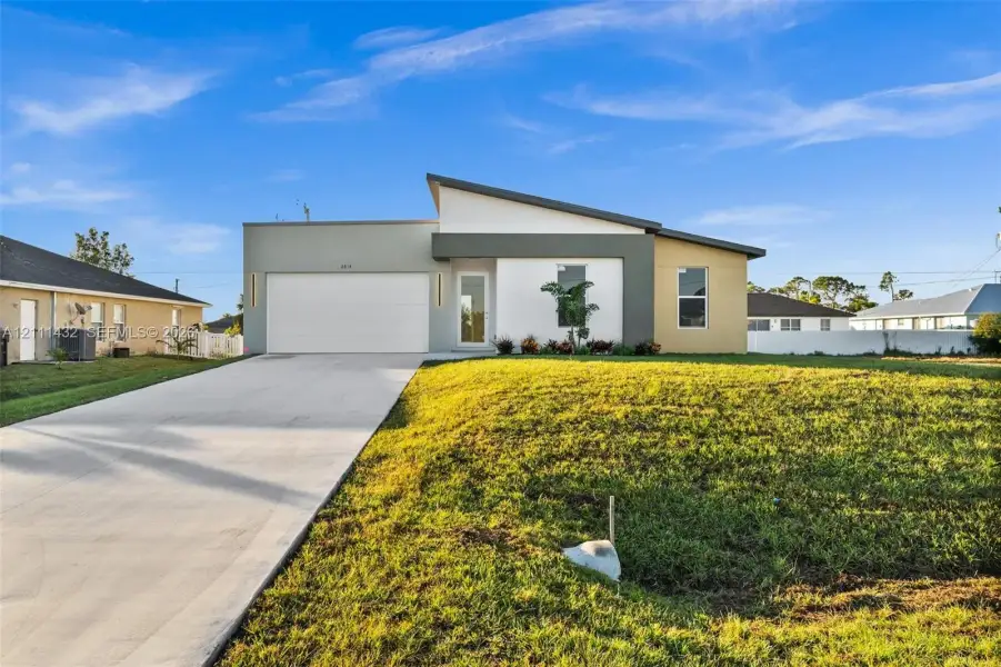 Front exterior of a new home in , Cape Coral, FL, highlighting curb appeal (Image 2). Front exterior of a new home in , Cape Coral, FL, highlighting curb appeal (Image 2).