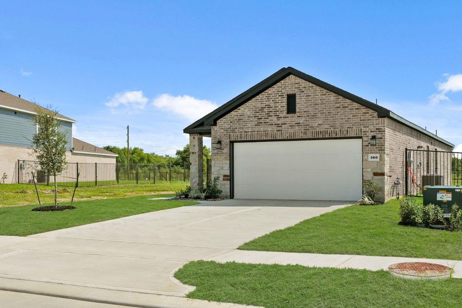 Front exterior of a new home in River Ranch Trails, Dayton, TX, highlighting curb appeal (Image 17). Front exterior of a new home in River Ranch Trails, Dayton, TX, highlighting curb appeal (Image 17).