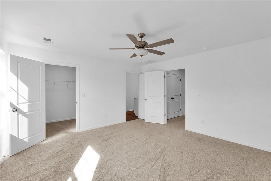 This spacious room features soft carpet, a ceiling This spacious room features soft carpet, a ceiling