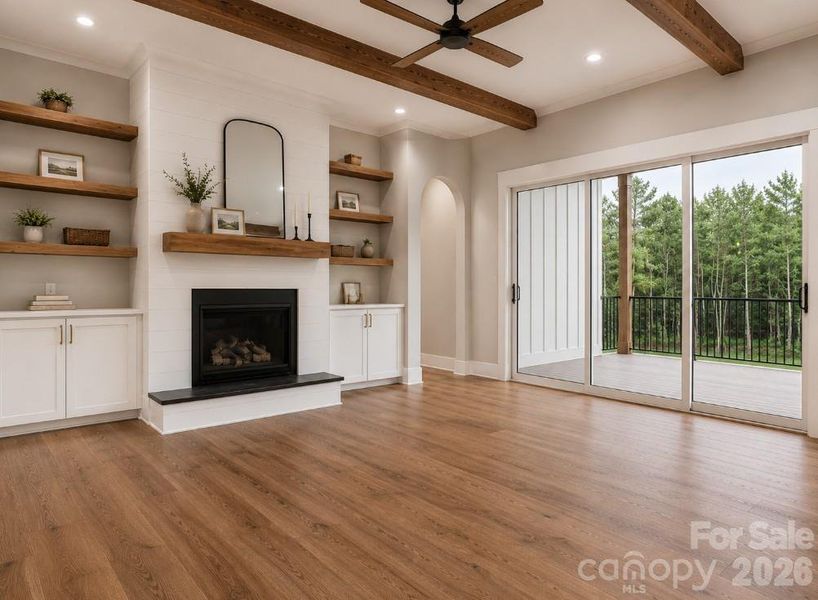 Family room looking toward fireplace w/12' ceiling. Beams are drop beams (this is a representative photo) Family room looking toward fireplace w/12' ceiling. Beams are drop beams (this is a representative photo)