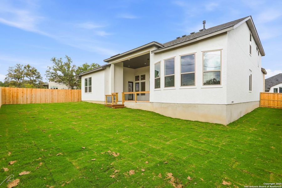 Exterior details and patio area of a home in Kinder Ranch 70's, San Antonio (Image 33).