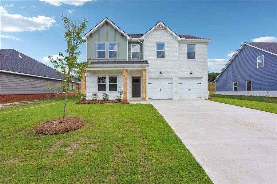 Front exterior of a new home in Conner Springs, Social Circle, GA, highlighting curb appeal (Image 18). Front exterior of a new home in Conner Springs, Social Circle, GA, highlighting curb appeal (Image 18).