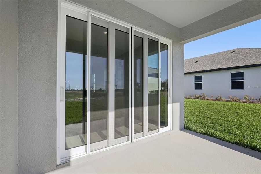 Exterior details and patio area of a home in Oakfield Trails, Parrish (Image 5).