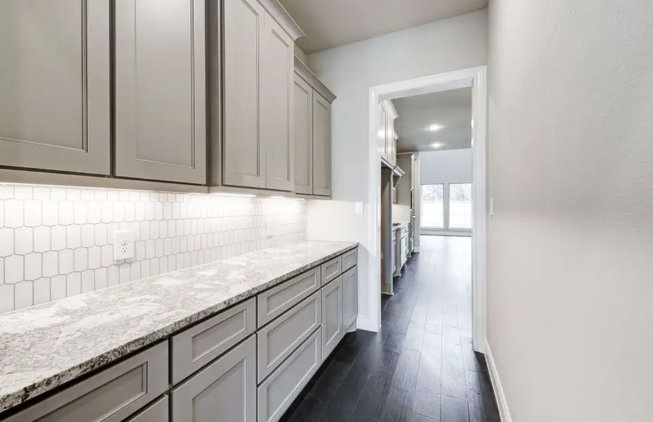 Representative furnished interior of a home built from the 2924 by Ravenna Homes in The Highlands 55′, Porter (Image 6). Representative furnished interior of a home built from the 2924 by Ravenna Homes in The Highlands 55′, Porter (Image 6).
