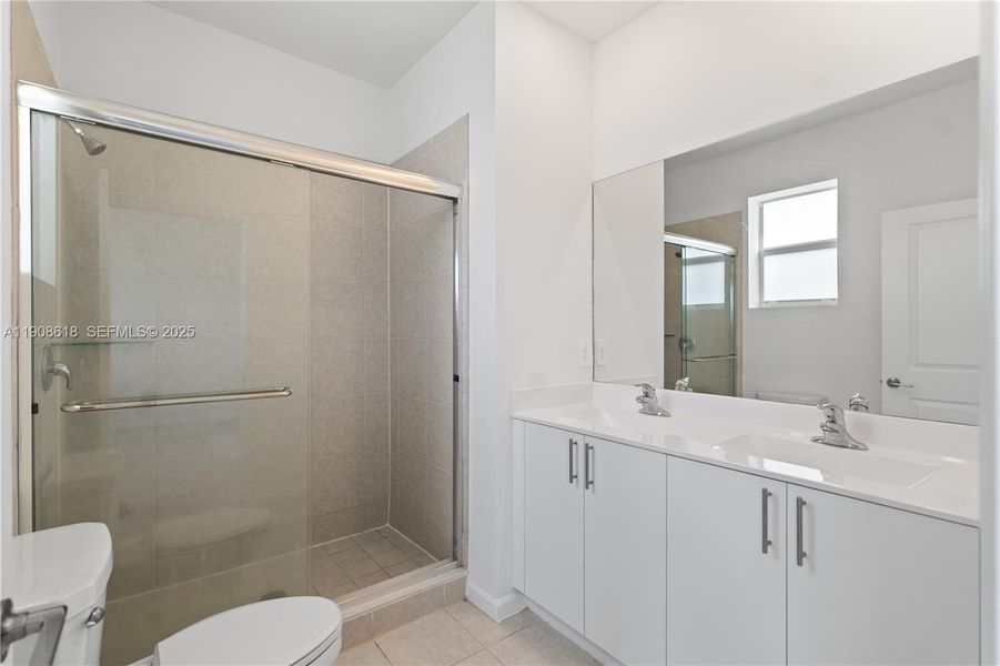 Furnished interior view inside a new home in Harmony Parc, Homestead (Image 13).