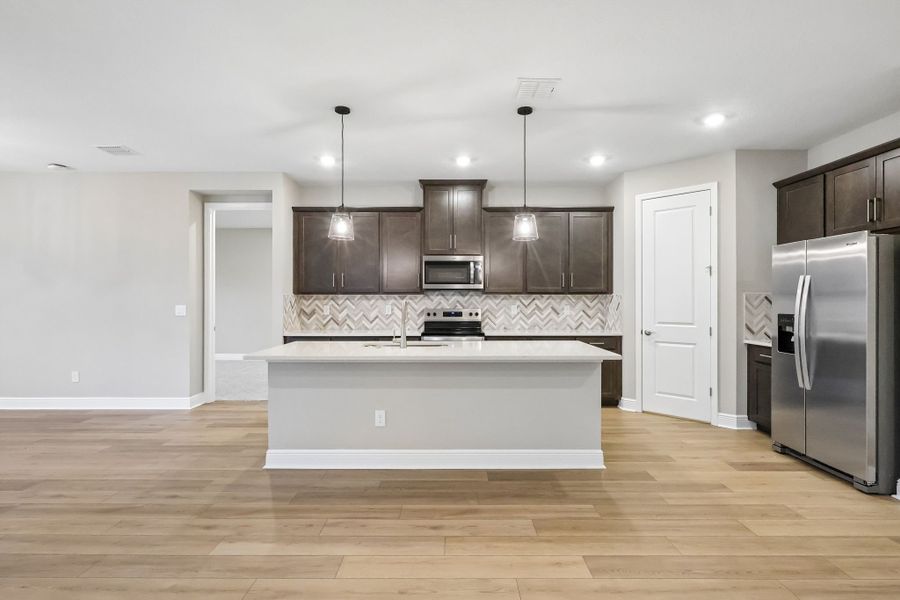 Furnished interior view inside a new home in Legends Preserve - Signature Series, Daytona Beach (Image 3).