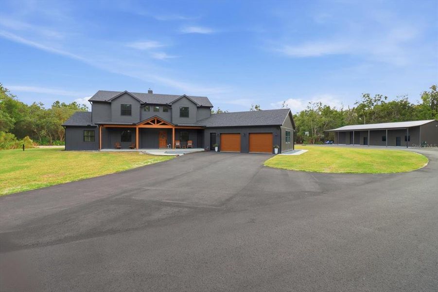 Front exterior of a new home in , Inglis, FL, highlighting curb appeal (Image 2).