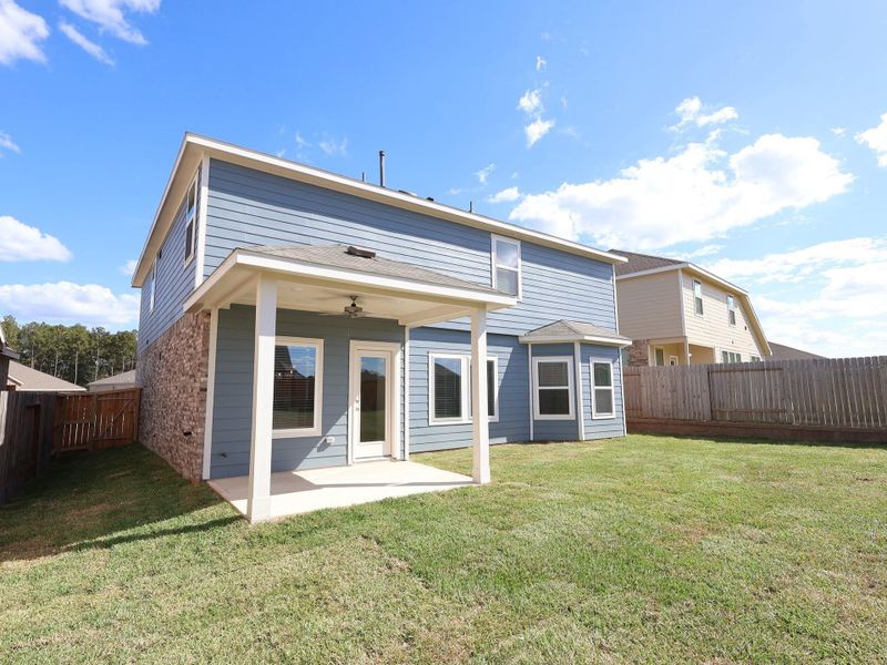 Exterior details and patio area of a home in Magnolia Ridge, Magnolia (Image 15). Exterior details and patio area of a home in Magnolia Ridge, Magnolia (Image 15).