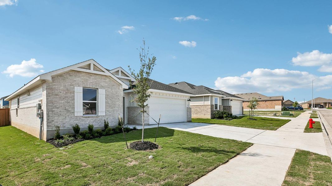 Front exterior of a new home in Thunder Rock, Marble Falls, TX, highlighting curb appeal (Image 2). Front exterior of a new home in Thunder Rock, Marble Falls, TX, highlighting curb appeal (Image 2).