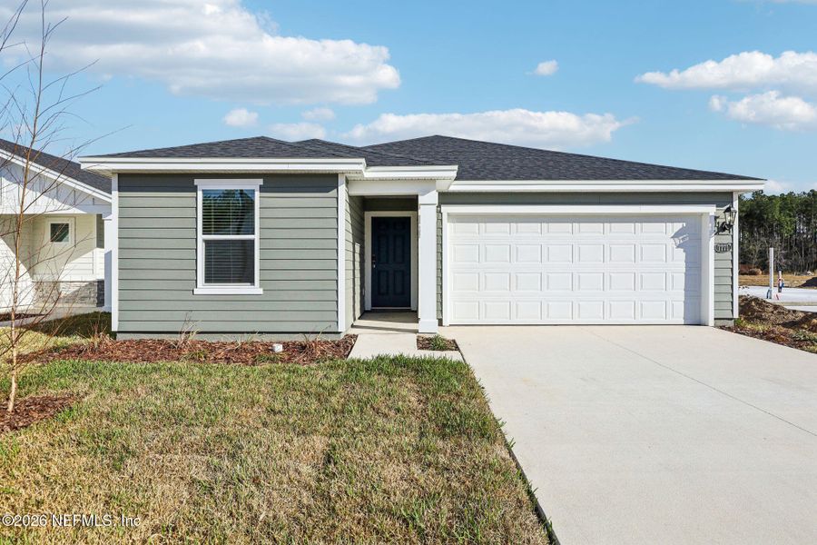 Front exterior of a new home in Kings Preserve, Jacksonville, FL, highlighting curb appeal (Image 19).