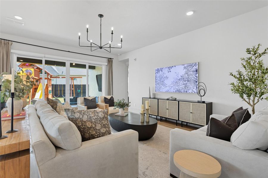 Living room connects the patio sliding doors and primary bedroom. Living room connects the patio sliding doors and primary bedroom.