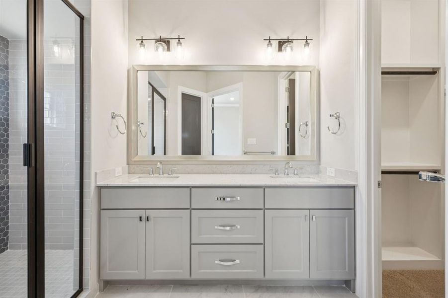 Dual sink vanity in primary bathroom.