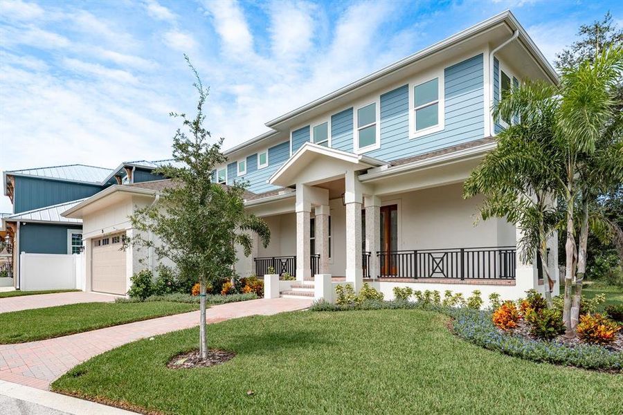 Front exterior of a new home in , Tarpon Springs, FL, highlighting curb appeal (Image 23).