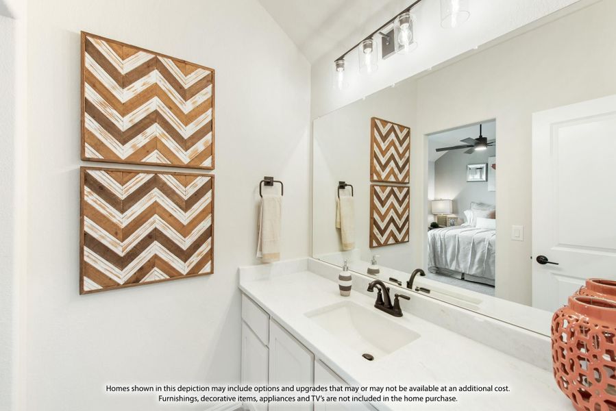 Bathroom vanity with white countertop, single sink, large mirror, and wood chevron wall art panels Bathroom vanity with white countertop, single sink, large mirror, and wood chevron wall art panels