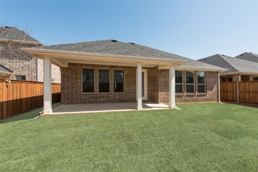 Exterior details and patio area of a home in Spiritas Ranch, Little Elm (Image 3).