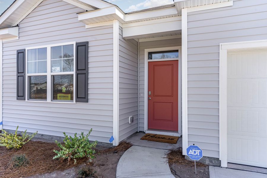Representative exterior photo of a completed home built from the CALI by D.R. Horton in Kingston Bay, Conway, SC (Image 23).