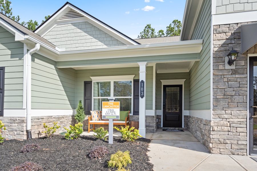 Front exterior of a new home in Maddox Station, Eatonton, GA, highlighting curb appeal (Image 20). Front exterior of a new home in Maddox Station, Eatonton, GA, highlighting curb appeal (Image 20).