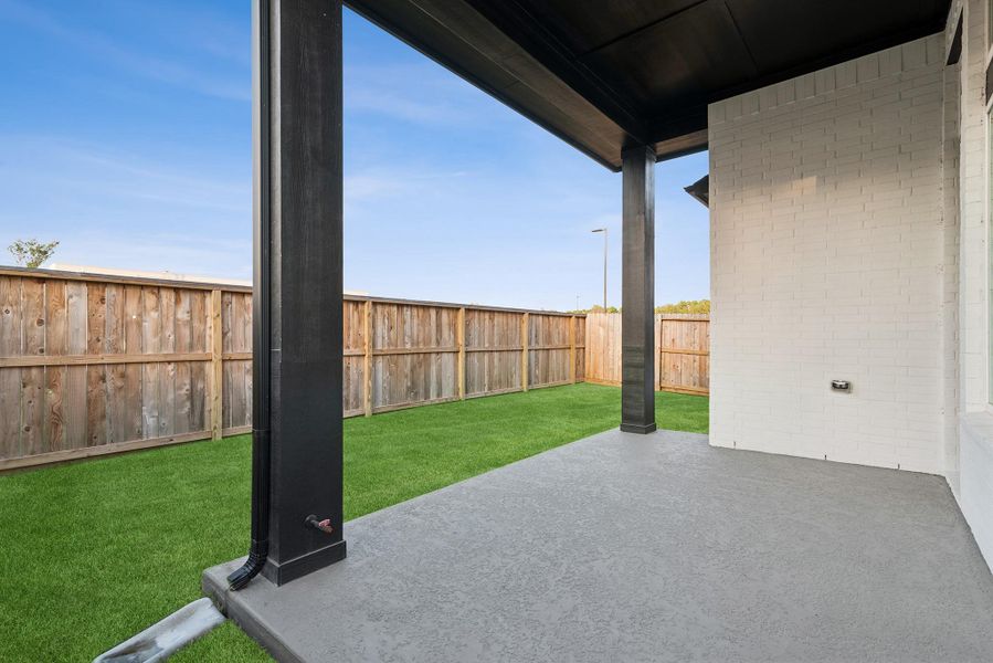 Exterior details and patio area of a home in The Highlands - Grove Collection, Porter (Image 25).