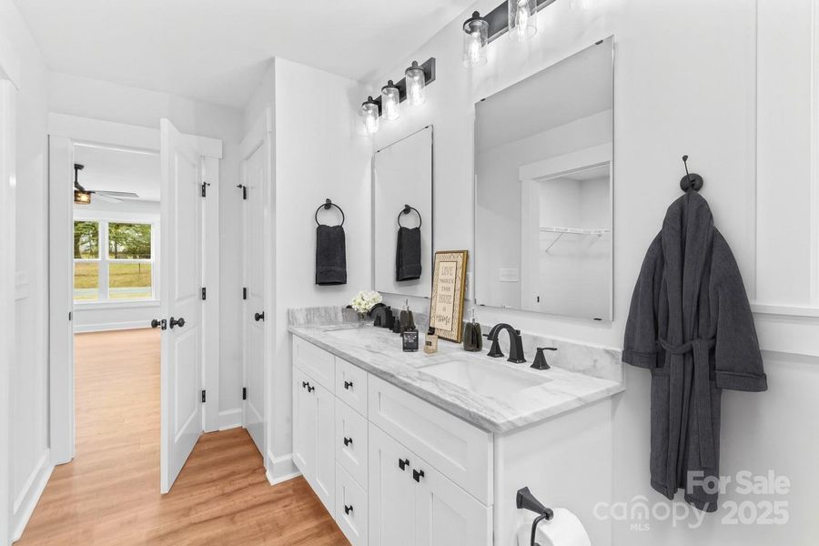 Marble dual vanities in main bath.