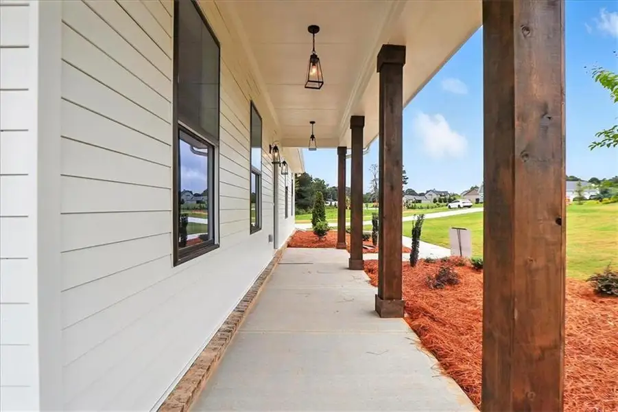 Exterior details and patio area of a home in Old Town Estates, Monroe (Image 33).