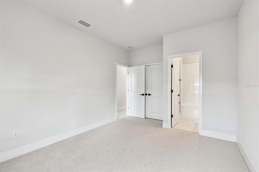 Spacious, unfurnished interior of a new home in Emerald Landing at Waterside at Lakewood Ranch – Lake Series, Sarasota (Image 14).