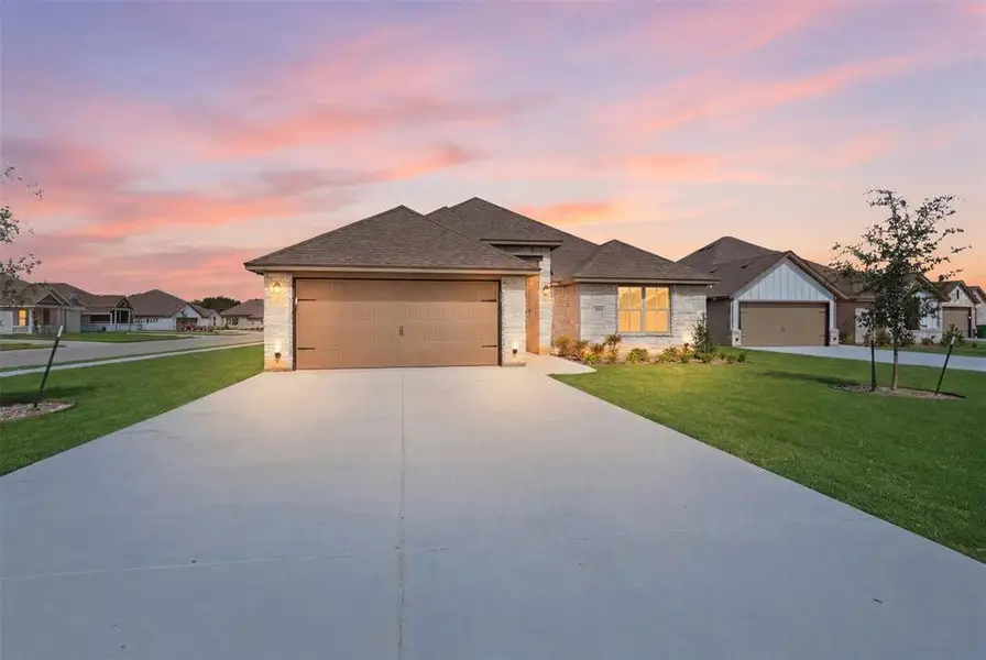 Front exterior of a new home in , Springtown, TX, highlighting curb appeal (Image 23).