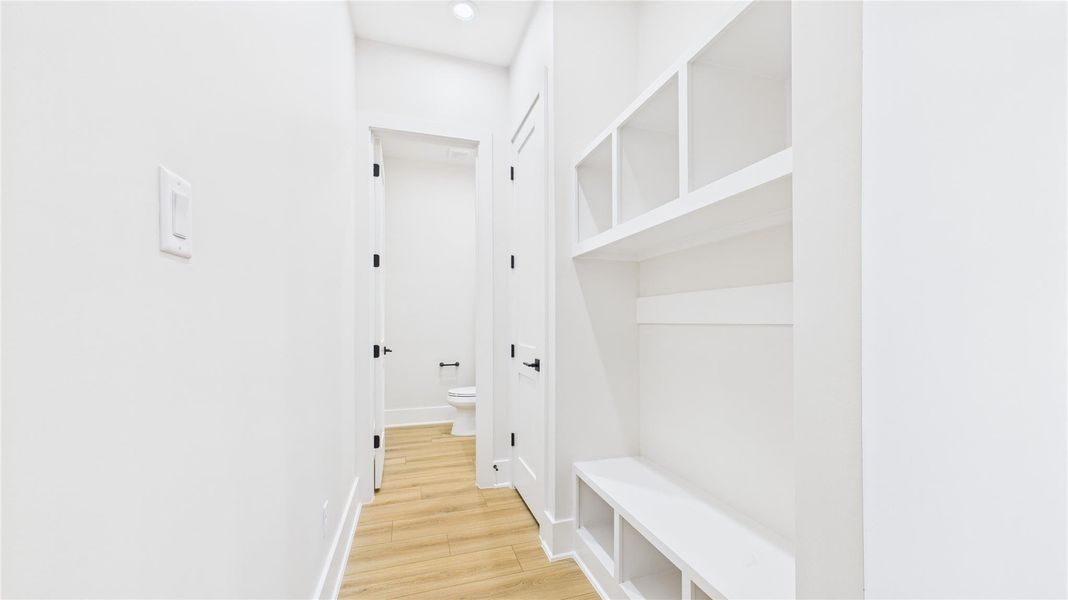 Mud room as you enter from the garage and half bath at the end of the hallway. Mud room as you enter from the garage and half bath at the end of the hallway.