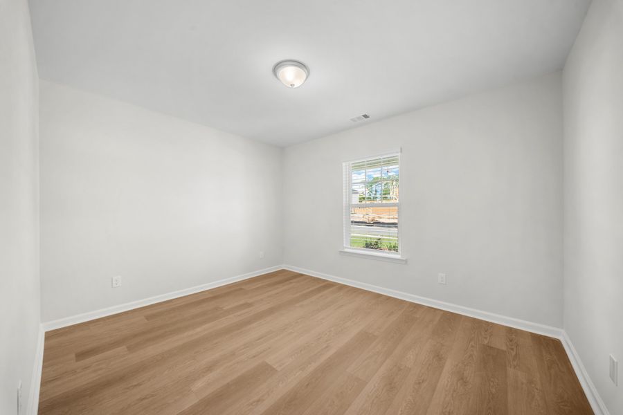 Representative unfurnished interior of a home built from the The Holly by Smith Family Homes in Belair East, Statesboro (Image 21).