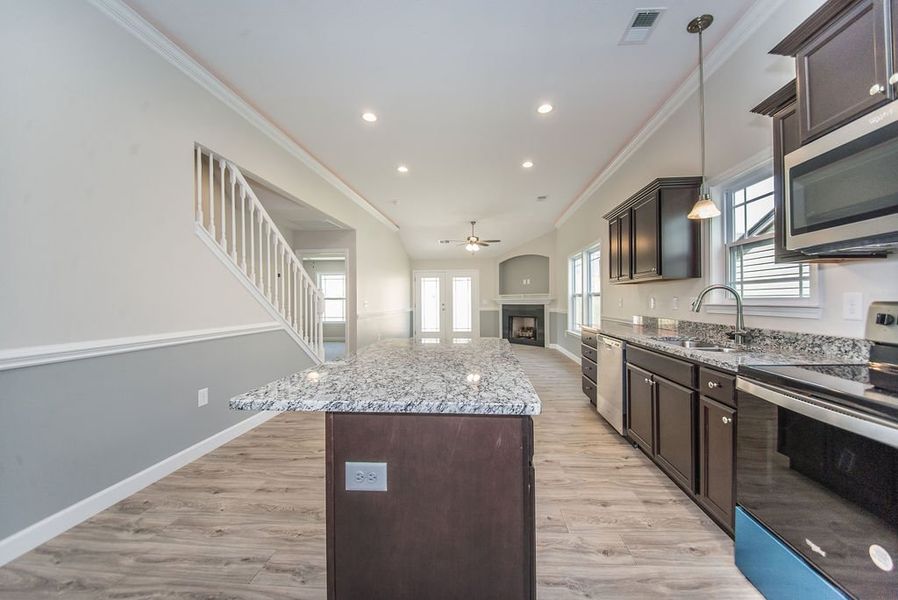 Representative furnished interior of a home built from the Quincy by Enchanted Homes in Lonesome Dove, San Antonio (Image 13).