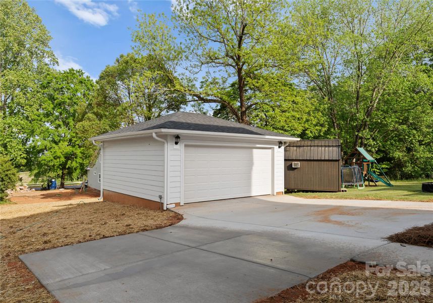Front exterior of a new home in , Belmont, NC, highlighting curb appeal (Image 24).